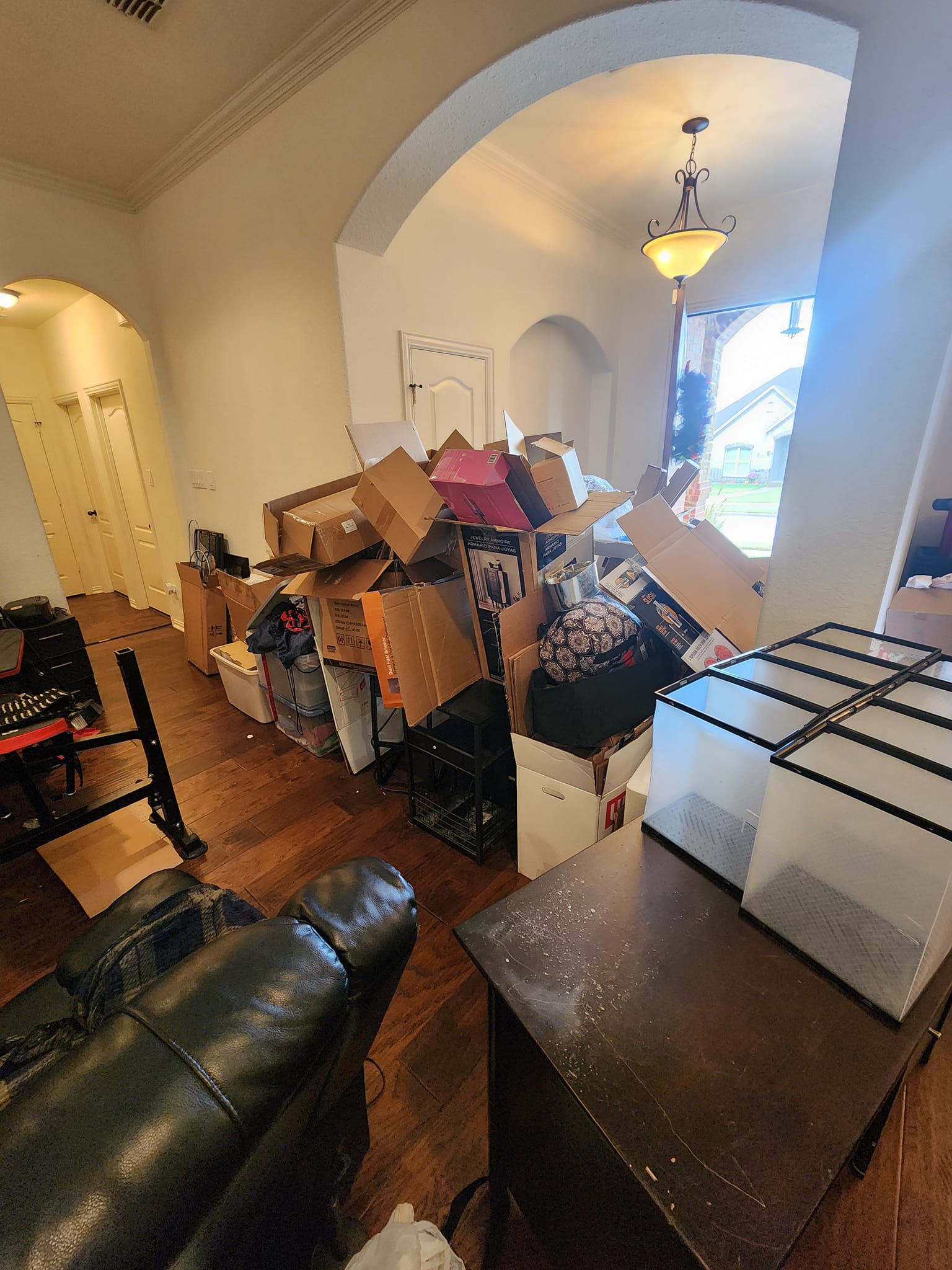 Cluttered room full of boxes and furniture — Arlington junk removal